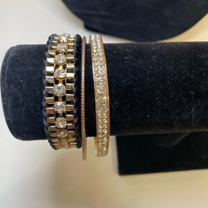 Three Gold Tone and Black Stacking Bracelet Set